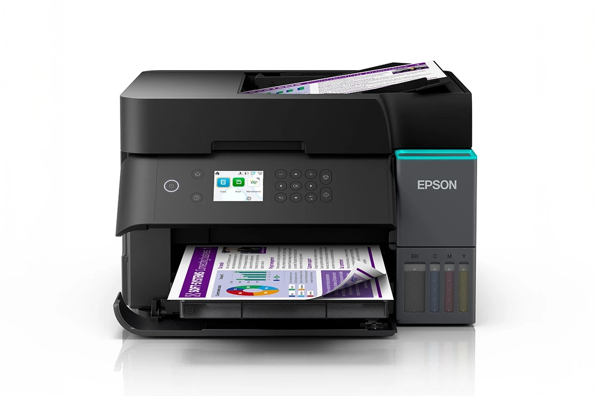Larger multifunction EcoTank printer in a busy open-plan office setting.