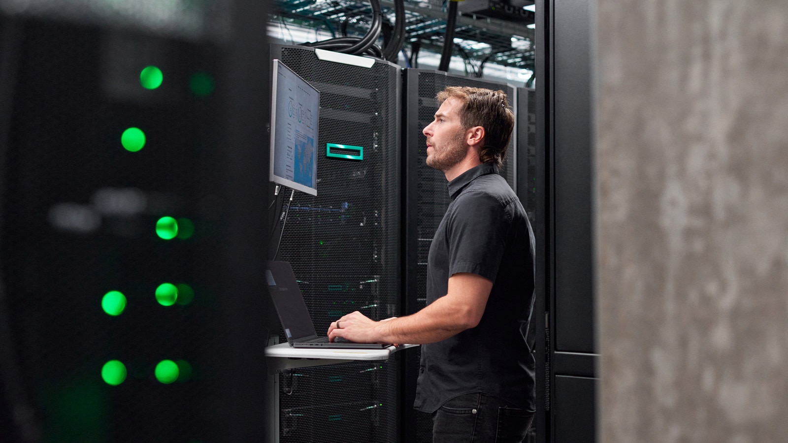 IT support engineer or technician working on server hardware in a data centre, or a support call centre scene.
