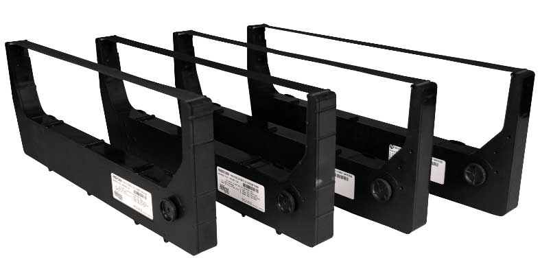 Close-up of printer ribbon cartridges, several stacked or on a shelf.